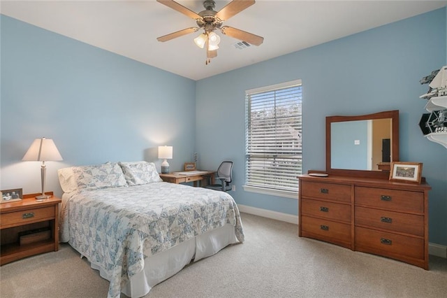 bedroom with baseboards, ceiling fan, visible vents, and light colored carpet