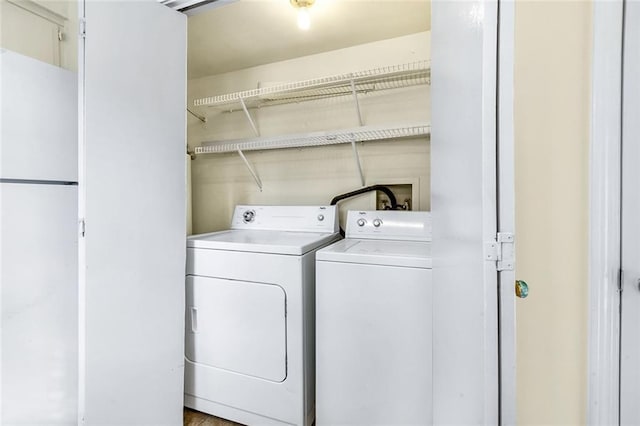 clothes washing area with laundry area and independent washer and dryer