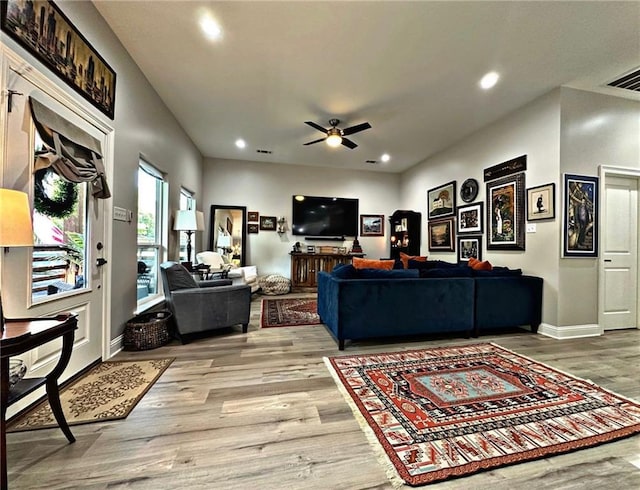 living area featuring ceiling fan, recessed lighting, baseboards, and light wood-style floors