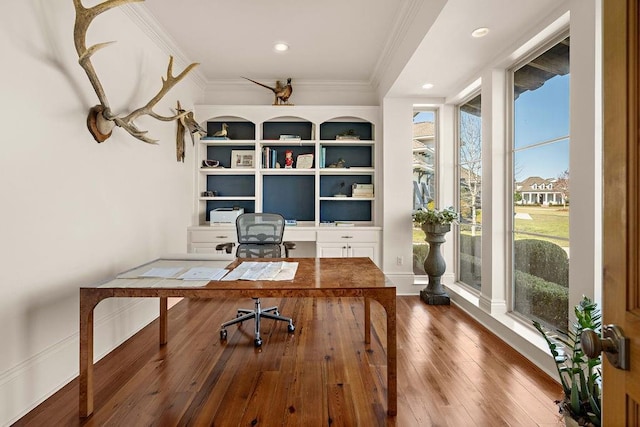 office with wood-type flooring, ornamental molding, baseboards, and recessed lighting