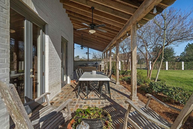 view of patio / terrace featuring ceiling fan, outdoor dining area, and fence