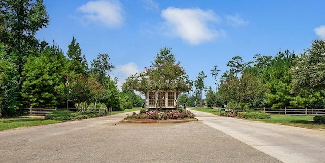 view of community with fence