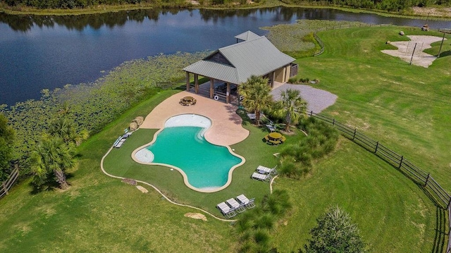 birds eye view of property with a water view