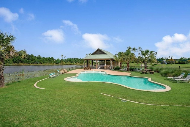 pool with a gazebo, a yard, and a water view