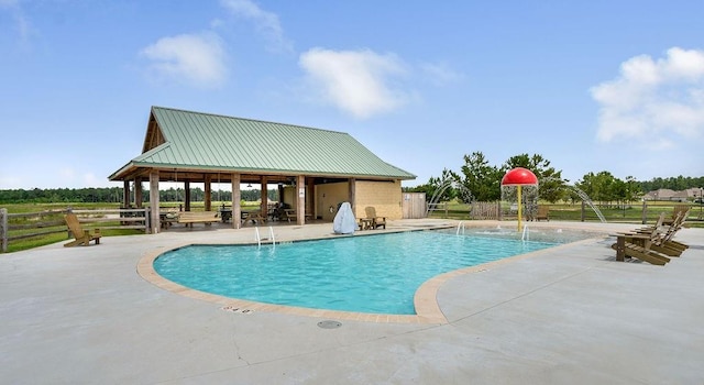 pool featuring a patio and a gazebo