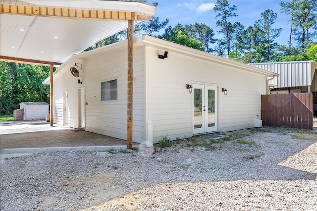 exterior space featuring french doors and fence