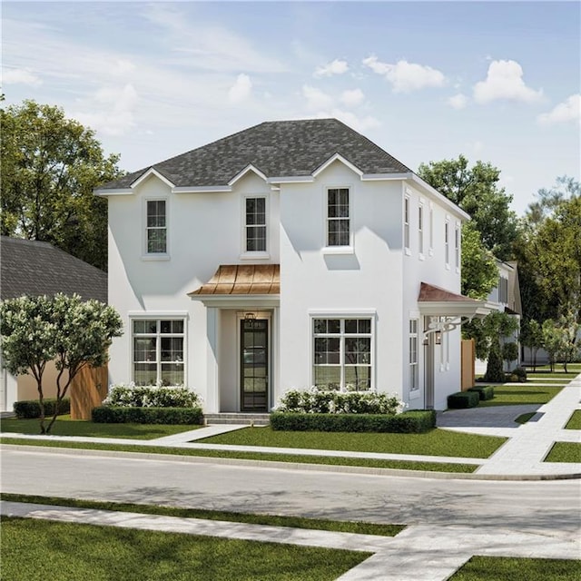 view of front of home with a shingled roof, a front yard, and stucco siding