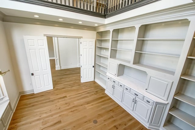 interior space with recessed lighting, light wood-type flooring, and baseboards