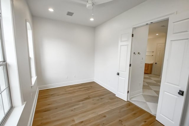 unfurnished room featuring visible vents, baseboards, recessed lighting, tile patterned floors, and a ceiling fan