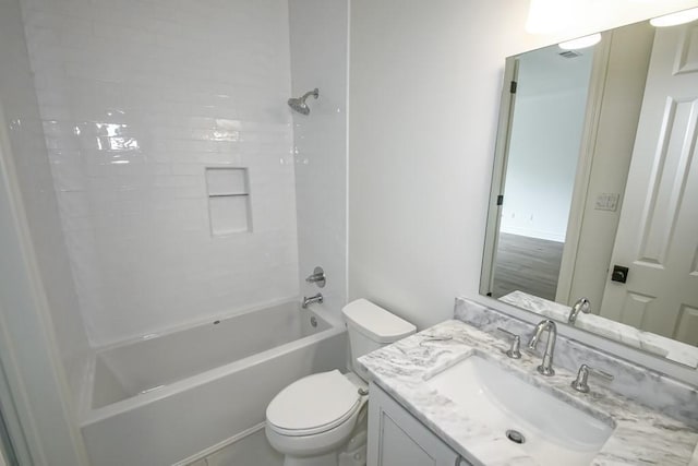 bathroom featuring tub / shower combination, toilet, and vanity