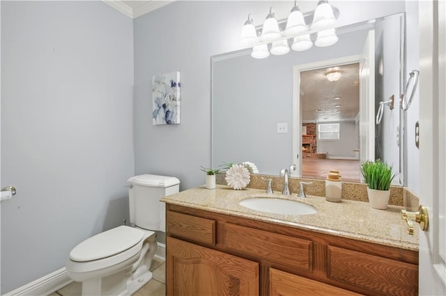 half bathroom featuring toilet, a fireplace, vanity, ornamental molding, and tile patterned floors