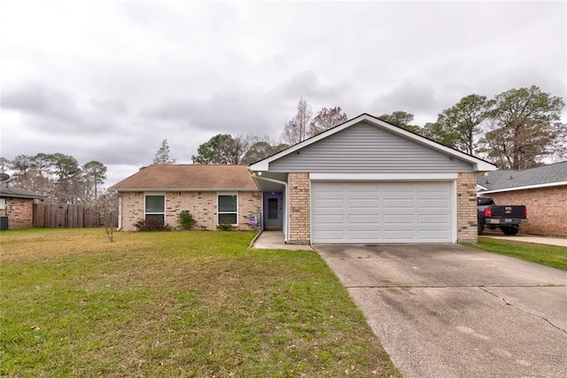 single story home featuring a garage, driveway, a front lawn, and brick siding