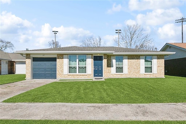 view of front of home with a garage, brick siding, concrete driveway, and a front yard