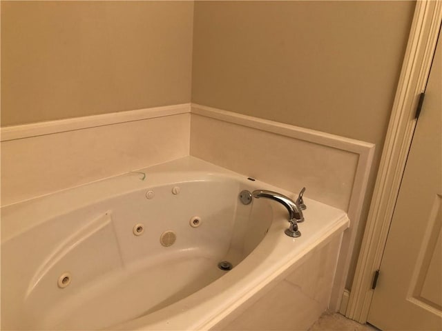 full bathroom featuring a jetted tub