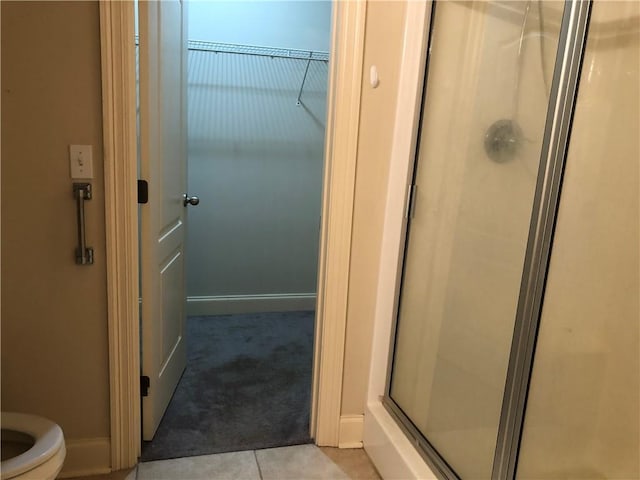 40145 Taylors Trl Unit 1002, Slidell, LA 70461 - full bath with a shower stall, a spacious closet, toilet, and baseboards