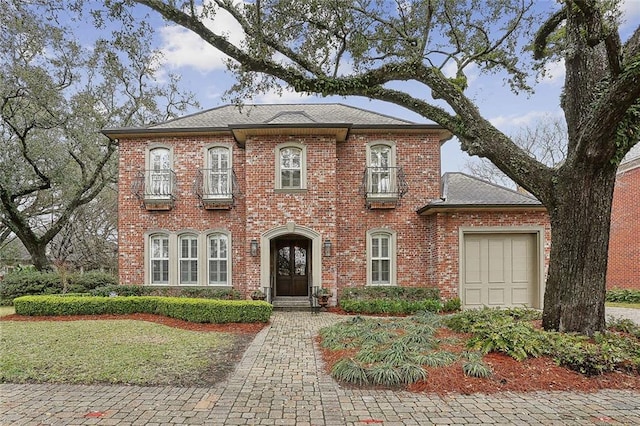 425 Turquoise St, New Orleans, LA 70124 - view of front of home featuring a garage, brick siding, and roof with shingles