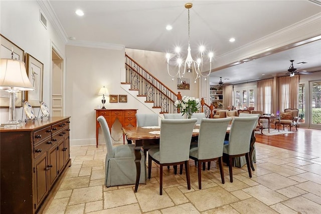 425 Turquoise St, New Orleans, LA 70124 - dining area featuring crown molding, stairs, ceiling fan with notable chandelier, baseboards, and stone tile flooring