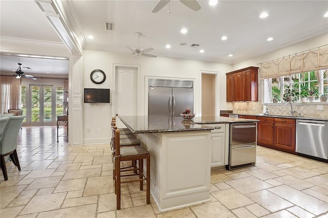 425 Turquoise St, New Orleans, LA 70124 - kitchen featuring stone tile flooring, stainless steel appliances, visible vents, and ceiling fan