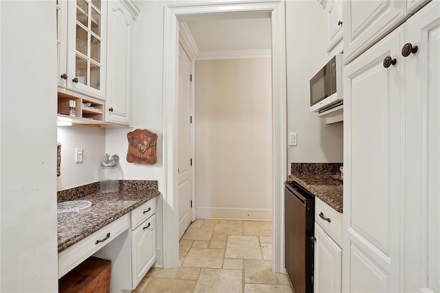 425 Turquoise St, New Orleans, LA 70124 - kitchen with crown molding, glass insert cabinets, white cabinets, and stone tile floors