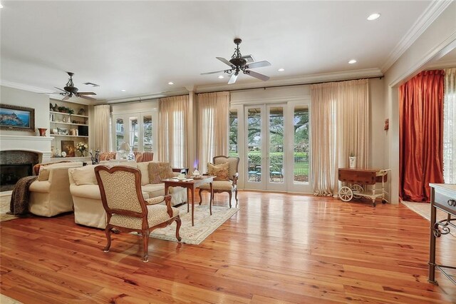 425 Turquoise St, New Orleans, LA 70124 - living area with a fireplace, ceiling fan, and ornamental molding
