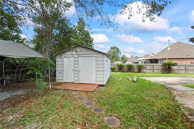 view of shed featuring a fenced backyard