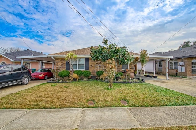 view of front of house with brick siding and a front lawn