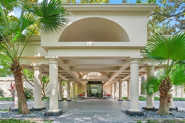 property entrance featuring stucco siding