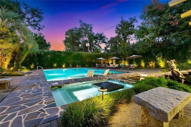 pool featuring a jacuzzi and a patio