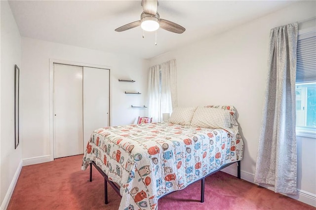 carpeted bedroom featuring a closet, a ceiling fan, and baseboards