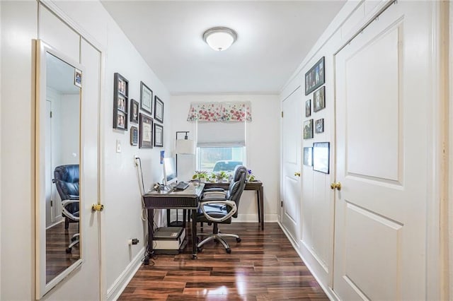 office space with dark wood-style flooring and baseboards