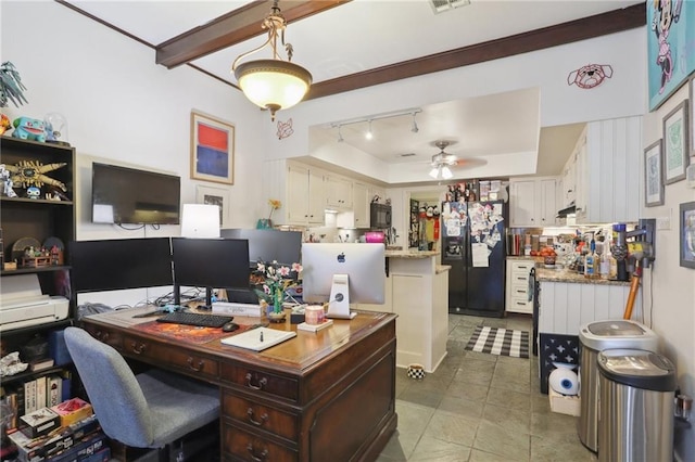 office area featuring a raised ceiling, visible vents, ceiling fan, and dark tile patterned floors