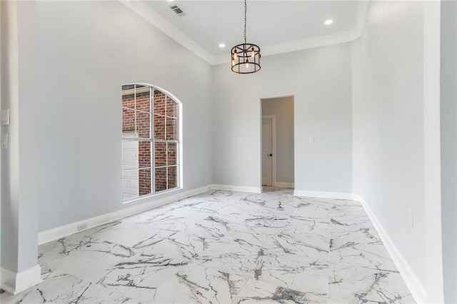 spare room with a notable chandelier, visible vents, baseboards, and ornamental molding