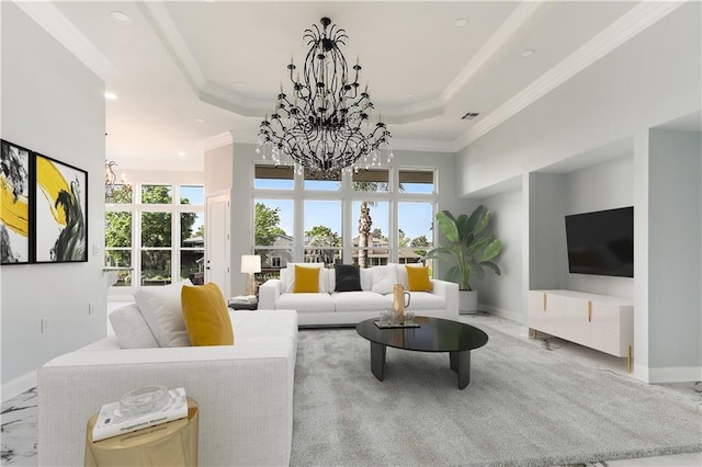 living area with visible vents, a raised ceiling, a chandelier, and crown molding