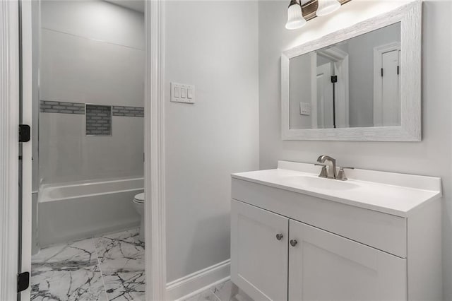 bathroom with toilet, marble finish floor, washtub / shower combination, baseboards, and vanity