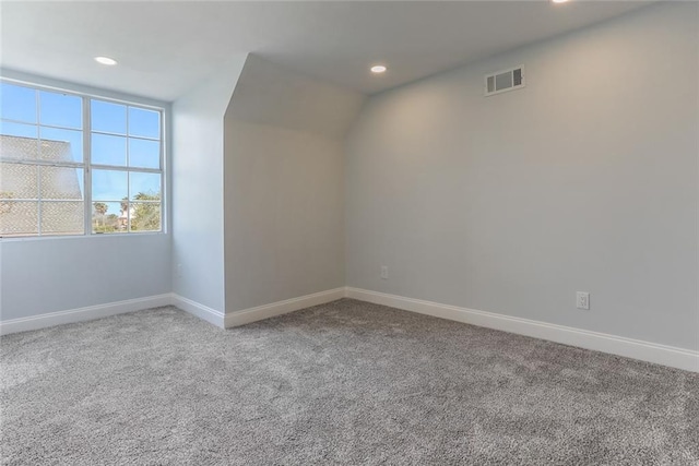 additional living space featuring recessed lighting, visible vents, carpet floors, and baseboards