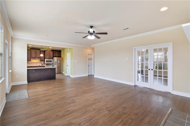 unfurnished living room with dark wood-style floors, french doors, crown molding, ceiling fan, and baseboards