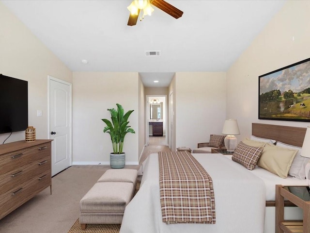 bedroom with lofted ceiling, light colored carpet, visible vents, ceiling fan, and baseboards