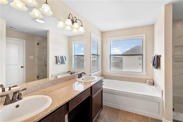 full bath with visible vents, a stall shower, a sink, and a bath