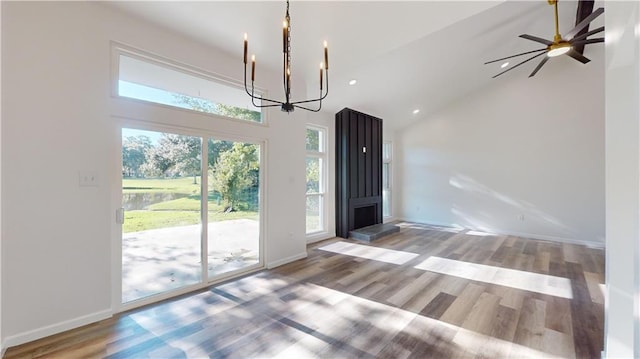 entrance foyer featuring high vaulted ceiling, recessed lighting, wood finished floors, and baseboards