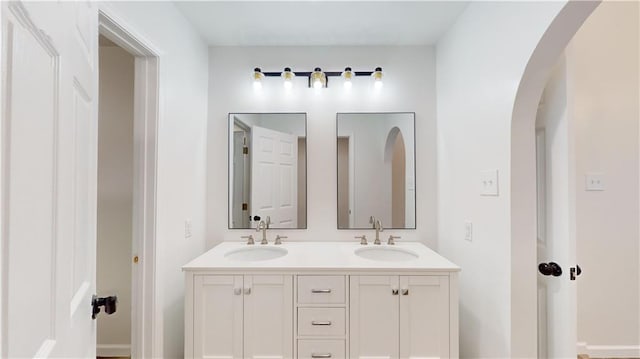 bathroom featuring double vanity and a sink