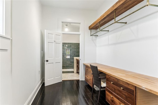 office space featuring dark wood-style flooring and baseboards