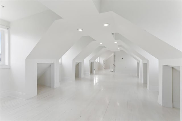 bonus room featuring lofted ceiling and recessed lighting