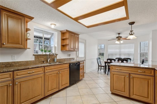 kitchen featuring a sink, black dishwasher, hanging light fixtures, open shelves, and brown cabinetry