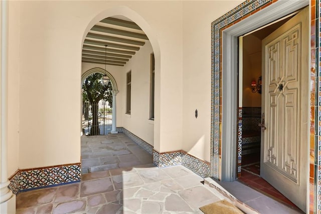 view of exterior entry with stucco siding