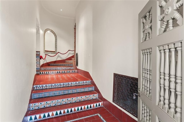 staircase with tile patterned floors