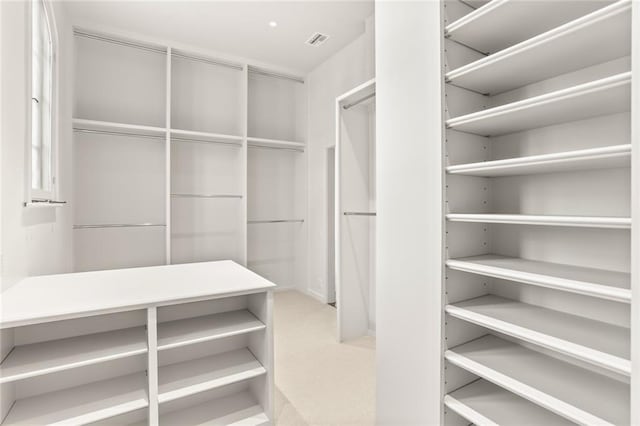 walk in closet with visible vents