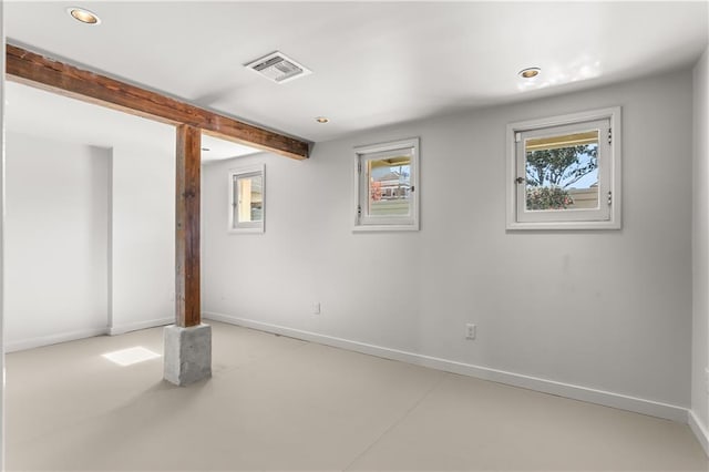 basement with baseboards, visible vents, and recessed lighting