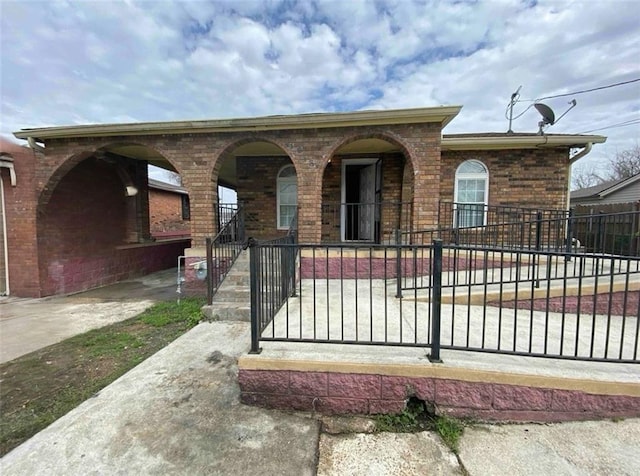 view of front facade featuring brick siding