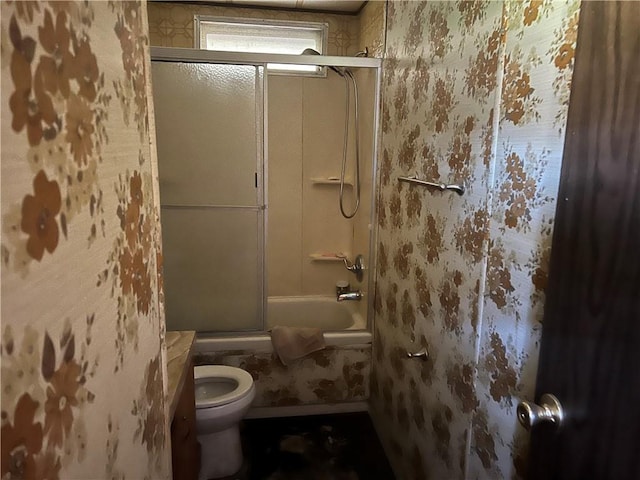 full bathroom featuring toilet and enclosed tub / shower combo