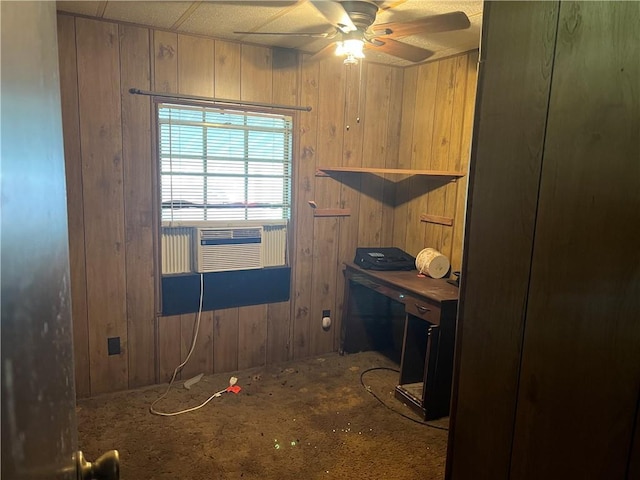 interior space with ceiling fan, cooling unit, and wooden walls